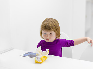 Image showing little girl playing games on tablet computer