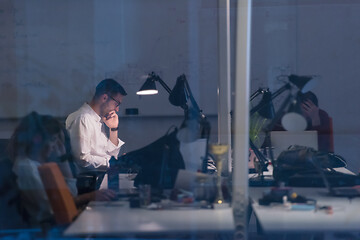 Image showing businessman working using a laptop in startup office