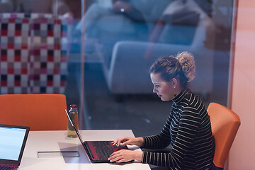 Image showing businesswoman using a laptop in startup office