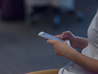 Image showing Businesswoman typing on phone  in office