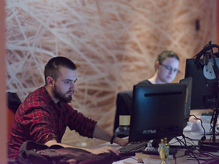 Image showing designers in the night startup office