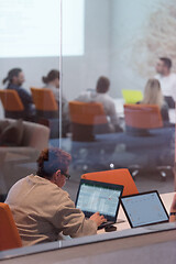 Image showing businesswoman using a laptop in startup office