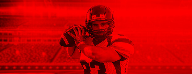 Image showing duo toned american football player in  arena at night