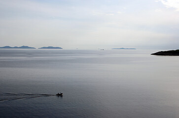 Image showing Fisherman in boat sailing out