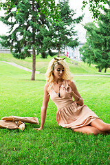 Image showing eauty blonde alone young woman resting in the park