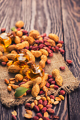 Image showing Natural peanut with oil in a glass