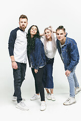 Image showing Group of smiling friends in fashionable jeans