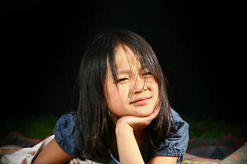 Image showing Portrait of a young cute girl looking at the camera