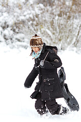 Image showing Girl playing in the snow in winter in denmark