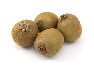 Image showing Four whole kiwi fruits with hairy skins 