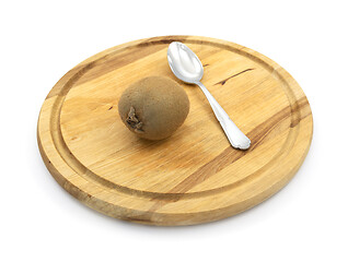 Image showing Kiwi on a board, ready to eat with a spoon