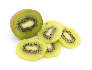 Image showing Half portion of kiwifruit, surrounded by freshly cut slices