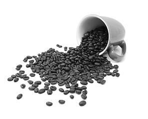 Image showing Aromatic roasted coffee beans pour from a mug