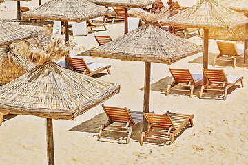 Image showing Beach Umbrellas and Lounge Chairs