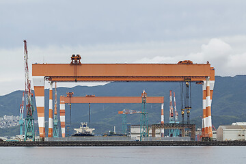 Image showing Two huge shipbuilding Gantry Cranes at the shipyard