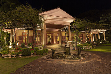 Image showing Old classic style vintage home with veranda and garden