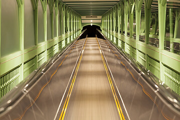 Image showing Moving escalator, blurred abstract background