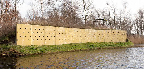 Image showing Wall with holes, nests for swallows