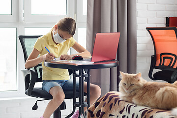 Image showing Ill girl schoolgirl studies online via computer