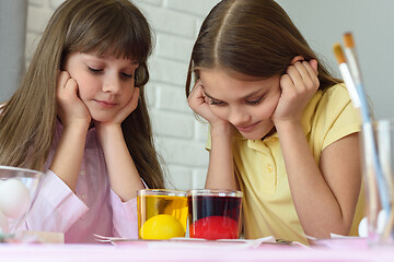 Image showing Children look in glasses with liquid dye while egg staining