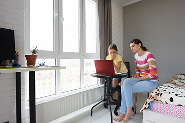 Image showing Tutor and girl study online without leaving home