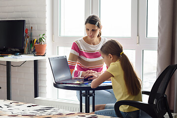 Image showing Tutor educates a child online