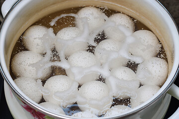 Image showing Chicken eggs are boiled in a pan, close-up