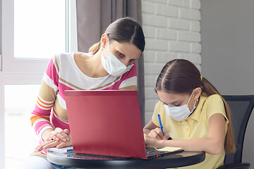 Image showing Mom and daughter jointly understand online services for distance learning