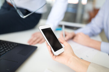 Image showing business team with smartphone working at office