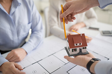 Image showing close up of architects discussing house project