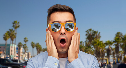 Image showing surprised man in sunglasses over venice beach