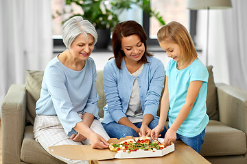 Image showing mother, daughter and grandmother eating pizza