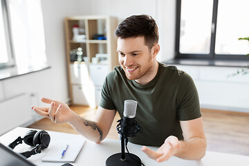 Image showing male blogger with microphone audio blogging