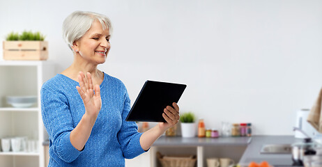 Image showing senior woman having video call on tablet computer