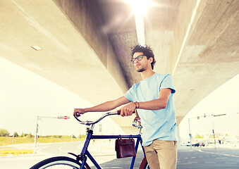 Image showing hipster man with fixed gear bike under bridge