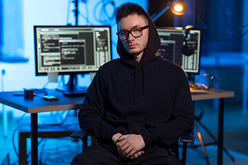 Image showing asian hacker in dark room with computers at night