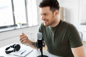 Image showing male blogger with microphone audio blogging