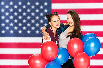 Image showing teenage girls with balloons over american flag