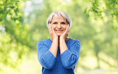 Image showing portrait of smiling senior woman in blue sweater