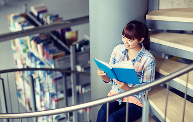 Image showing high school student girl reading book at library