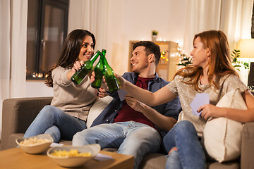 Image showing friends playing cards and drinking beer at home