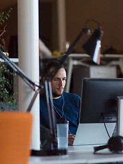 Image showing businessman working using a laptop in startup office