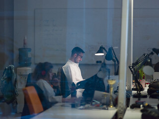 Image showing businessman working using a laptop in startup office