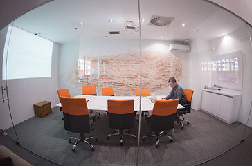 Image showing businessman working using a laptop in startup office