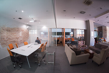 Image showing businessman working using a laptop in startup office