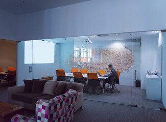 Image showing businessman working using a laptop in startup office