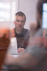 Image showing businessman working using a laptop in startup office