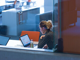 Image showing businesswoman using a laptop in startup office