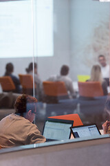 Image showing businesswoman using a laptop in startup office