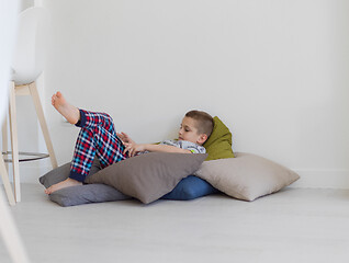 Image showing little boy playing games on tablet computers